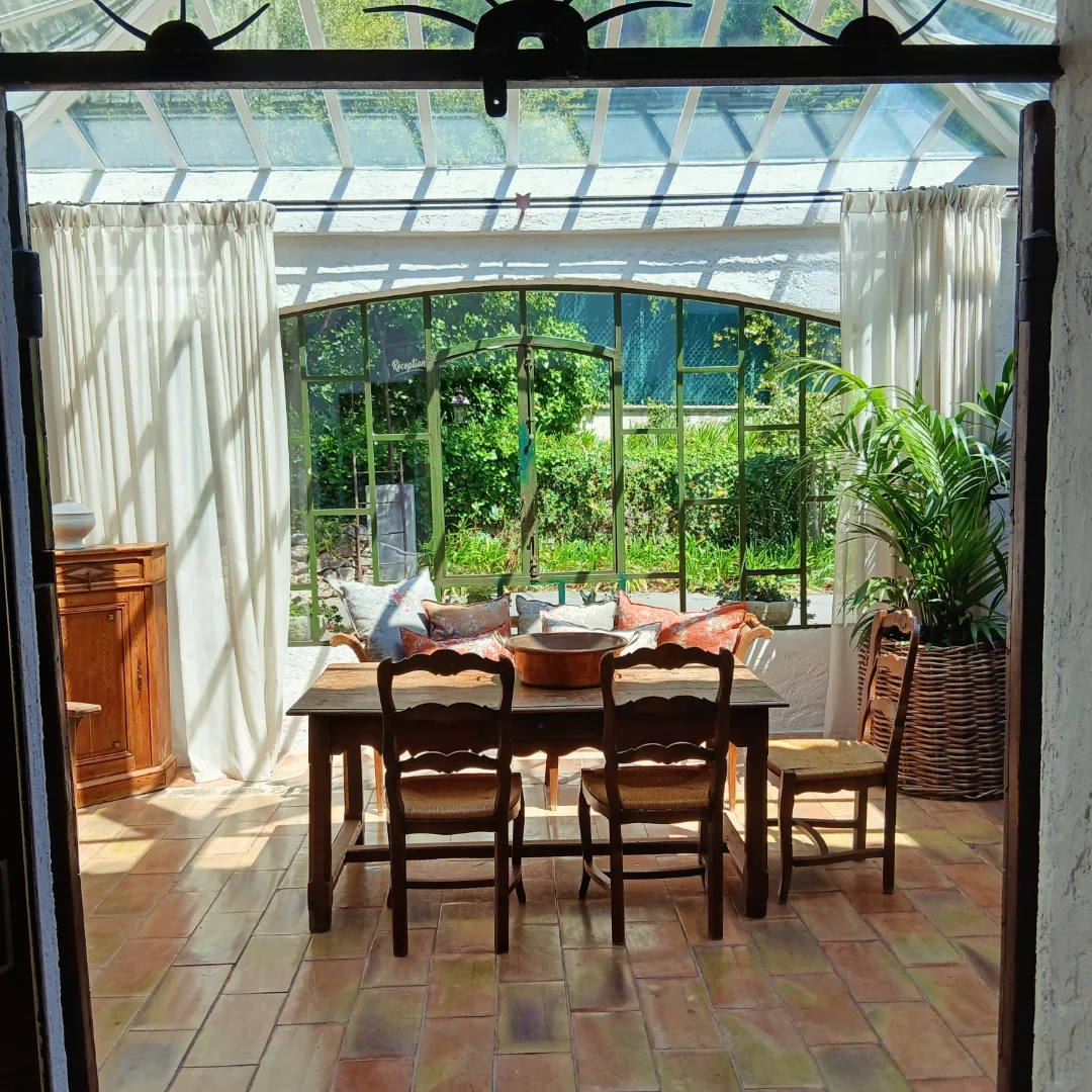 Light-filled lounge space looking out to olive groves